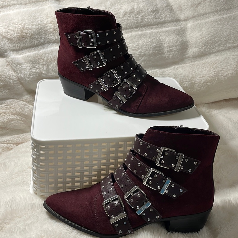 Boots with buckles.